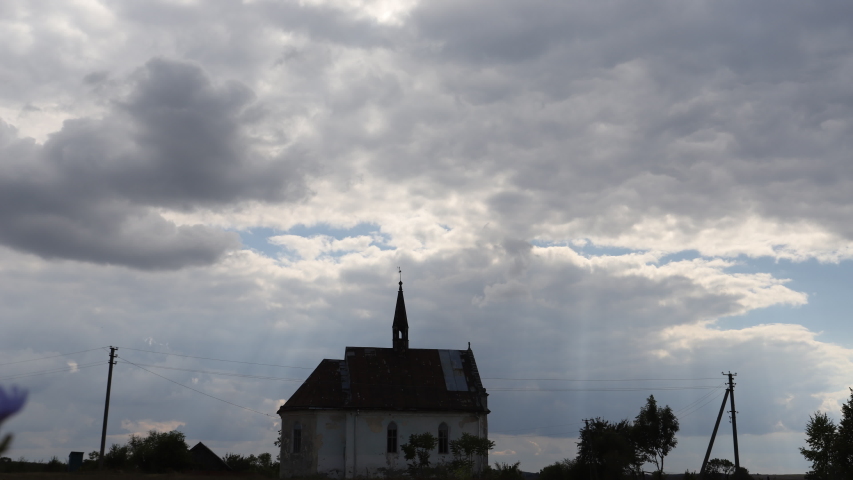 The ruins of the old Catholic church. Ruins of the Old Temple. against the background of dark rain clouds. time lapse video 4k