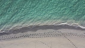 Footprints on beach, aerial video footage 