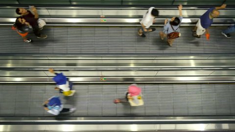 Moving Walkway and Travellers at Changi Airport in Singapore - August, 2019
