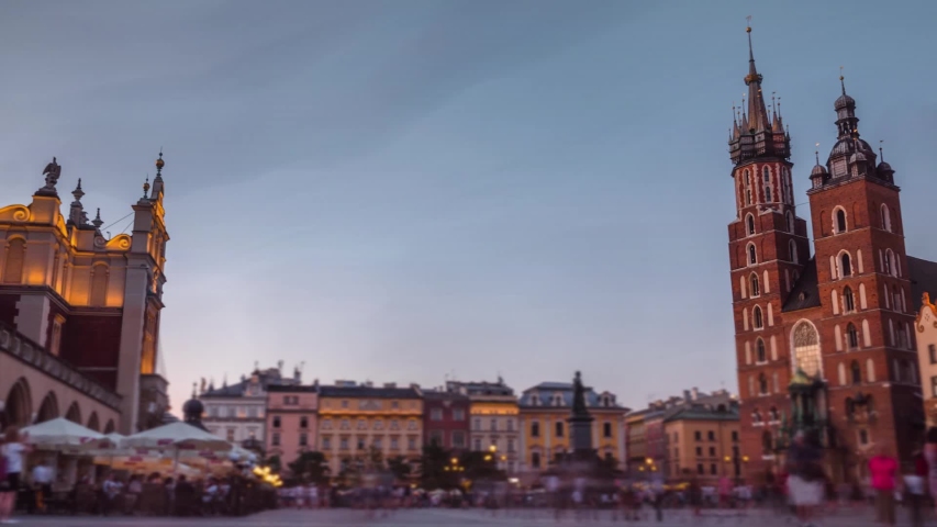 Timelapse, fast motion, view of the central square, animated text Travel to Poland Krakow. Historic city center, travel and tourism concept. summer evening, the end of the day, sunset. 