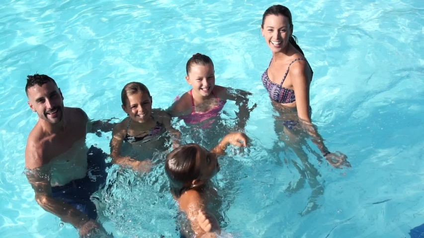 Family enjoying time at the swimming-pool | Shutterstock HD Video #1036815719