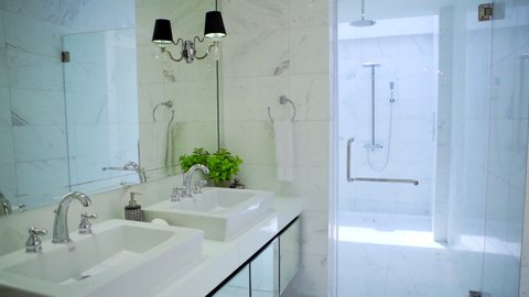a modern and luxury bathroom with white interior