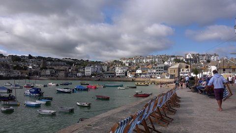 St Ives, Cornwall / England - August 24 2019: St Ives has become a famous holiday resort because of its milt temperatures and southerly position. Tourists relaxing UK 4K.