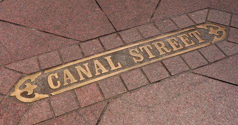 Canal Street sidewalk marker sign in the French Quarter New Orleans Louisiana USA