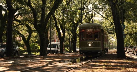 New Orleans, Louisiana - June 18, 2019: Passengers ride the historic streetcar along Saint Charles Avenue in the Garden District of New Orleans Louisiana USA