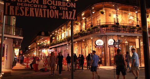 New Orleans, Louisiana - June 16, 2019: Crowds of people party and walk by the famous Preservation Hall Jazz Bar along the French Quarter and restaurants on Bourbon Street New Orleans Louisiana USA