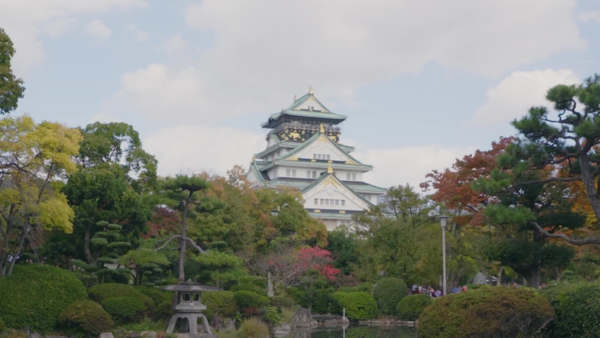 Osaka Castle Japan, Historic Landmark From 16th Century.Autumn Garden View Over Pond