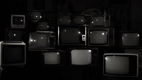 Stacked Retro TVs with a Spiral Galaxy as a Background. Black and White Tone. Elements of this video furnished by NASA.