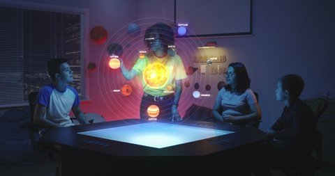 Medium shot of a female teacher using an interactive solar system hologram in an astronomy class