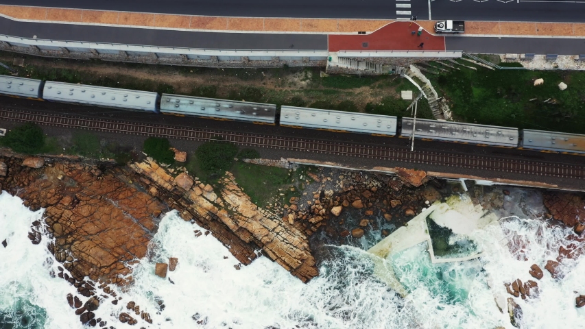 Aerial view of a train running along the coast in South Africa