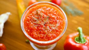 homemade hot adjika from tomatoes, hot and sweet peppers with spices