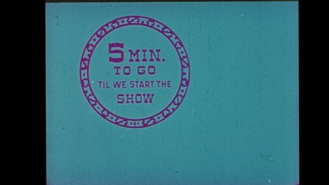 1960s Drive-in Movie Theater Intermission Announcement: Countdown Clock.  Polarized Luminance Key with Blue Tint, A Clown Alerts Audience of Time remaining til Next Film. Countdown from 5 to 1