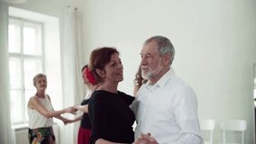 Group of senior people in dancing class with dance teacher. Slow motion. - Powered by Shutterstock - Get 15% off with code: PIKWIZARD15