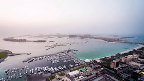 High angle view of The Palm Jumeirah & Jumeirah Beach in Dubai, United Arab Emirates time lapse