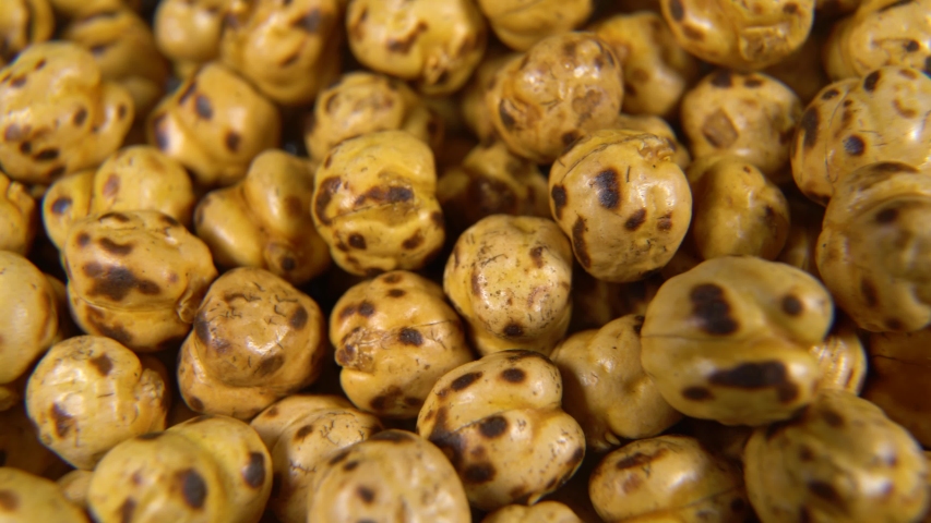 Rotating roasted chickpea pattern - roasted chickpea texture | Shutterstock HD Video #1036882430