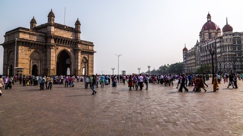 Mumbai, India - March 17, 2014 : People visiting the Gateway of India in front of The Taj Mahal Palace time lapse