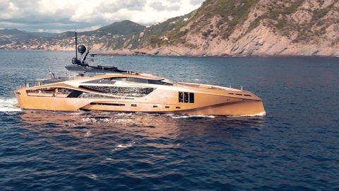 Stunning drone shot of luxurious golden yacht 