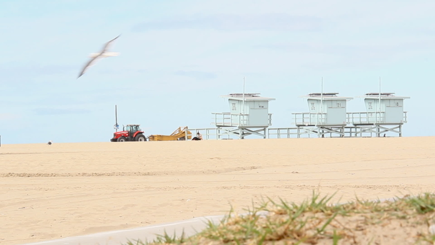 tractor on beach, life guard stations