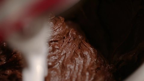 Closeup shot of making dough for brownies in mixer.Mixing cocoa powder and flour in mixer.Preparation for making brownies.