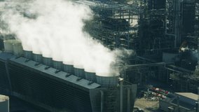 Aerial view steam emissions polluting the environment from Los Angeles oil refinery industrial cooling towers California USA - Powered by Shutterstock - Get 15% off with code: PIKWIZARD15