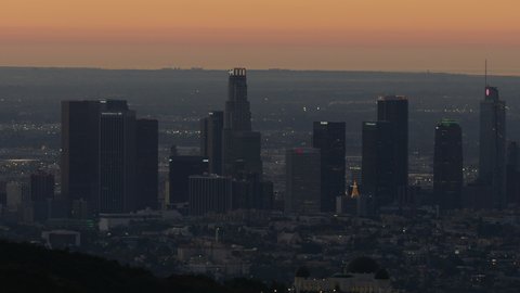 Los Angeles USA - February 2019: Aerial sunrise view across downtown Los Angeles from Griffith Park with observatory and financial district skyscrapers California USA
