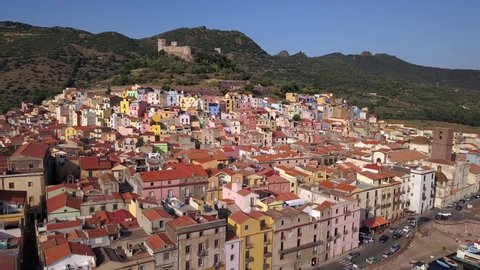 Bosa, Sardinia, Italy -Drone Aerial Shot over the colourful town of Bosa and its castle. A typical Italian and mediterranean landscape