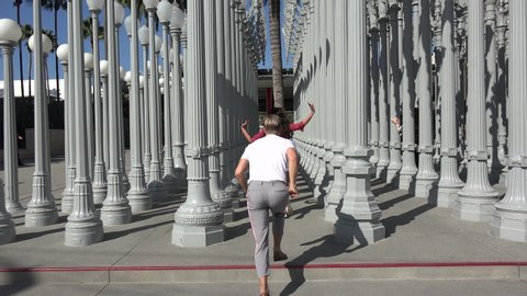 LOS ANGELES, CA/USA - OCTOBER 9, 2018: Dancer Derek Hough and Hayley Erbert spotted dancing at the Urban Light sculpture at the Los Angeles County Museum of Art
