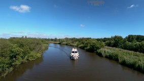 Aerial Drone Footage of a boat along the River Waveney, Norfolk.
