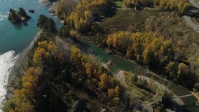 Autumn landscape. Mountains. River. Altai. Aerial video shooting