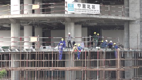 ADDIS ABABA, ETHIOPIA – MARCH 2019: Chinese and Ethiopian workers welding at construction site in central Addis Ababa, growing political and economic influence China at African continent