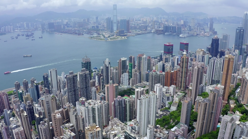 Aerial View drone 4k footage Of Modern Skyscrapers In Hong Kong. buildings in Hong Kong city. Victoria Harbour. Royalty-Free Stock Footage #1036951931