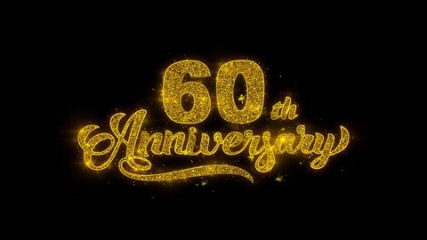60th Happy Anniversary Typography Written with Golden Particles Sparks Fireworks Display 4K. Greeting card, Celebration, Party Invitation, calendar, Gift, Events, Message, Holiday, Wishes Festival