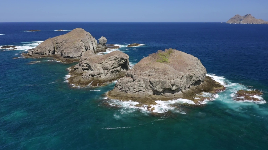 4K Aerial View Of blue Lagoon, coral Reef, And bautiful Island In Komodo National Park, Indonesia.