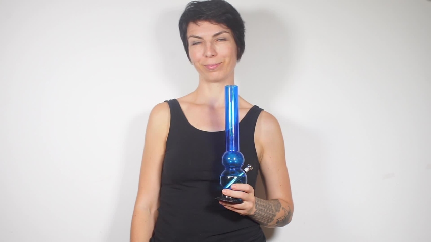 portrait of a girl smokes medical marijuana in a coffee shop