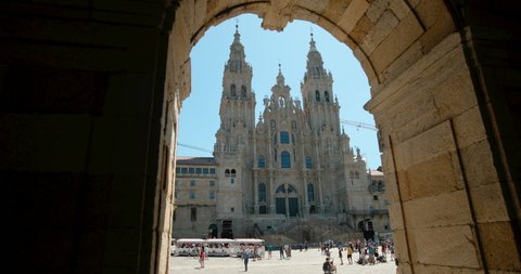 SANTIAGO DE COMPOSTELA / SPAIN - AUGUST 2019:People, tourists and pilgrims near the cathedral of Santiago de Compostela, famous Spanish town at the end of Camino de Santiago or Way of St. James