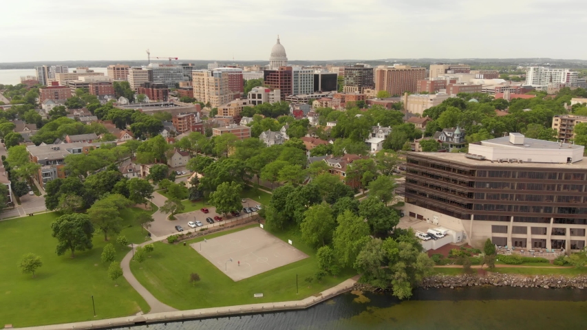 4k aerial footage panning left to right of Madsion Wisconsin capital building and surrounding buildings in downtown