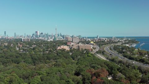 Aerial Establishing Shot of the Gardiner Expressway Leading into Downtown Toronto. Cinematic 4K Footage.