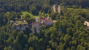 Aerial view around the Lichtenstein Castle in Germany ona sunny day in Summer. Pan to the left from the front of the castle.