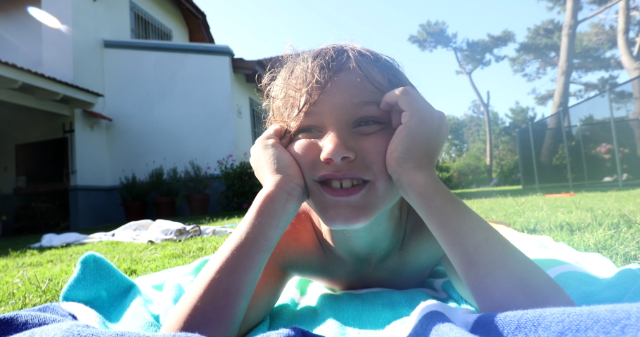 Handsome child laid on grass