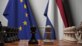 Flags of the EU and the Netherlands behind chess board. The first pawn moves in the beginning of the game. Political rivalry conceptual 3D animation - Powered by Shutterstock - Get 15% off with code: PIKWIZARD15