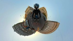 Relive reality Discovering Video for the virtual reality of a motorcyclist riding around the city. A panoramic video of riding a motorcycle around the city. Video of a small planet vr Video 360