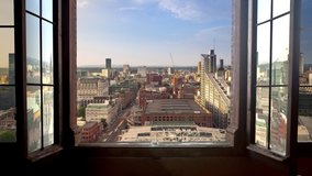 Manchester city timelapse day to nigh seen through a window high point of view uk england