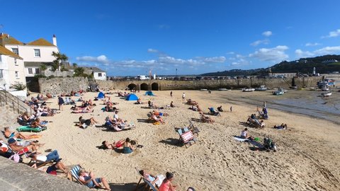Saint Ive, Cornwall / England - 09/05/2019: People on the beach of Saint Ives, coast of Cornwall