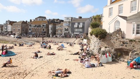 Saint Ive, Cornwall / England - 09/05/2019: People on the beach of Saint Ives, coast of Cornwall
