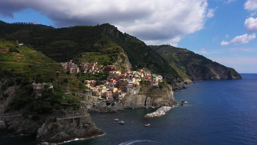 Panorama view of Manarola village one of Cinque Terre in La Spezia, Italy. Flight by a drone.
