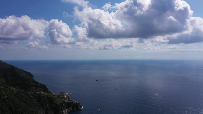 Panorama view of Manarola village one of Cinque Terre in La Spezia, Italy. Flight by a drone.