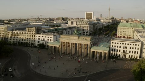 Berlin. The drone starts at the Brandenburg gate (Brandenburger Tor) and is revealing the skyline including the TV tower, the Bundestag, the Tierpark and many sights of the capital of Germany.