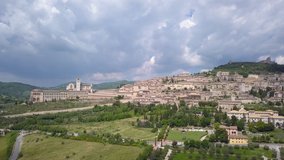 Drone aerial video of the small ancien Assisi village, in Umbria region, Italy at summer season.