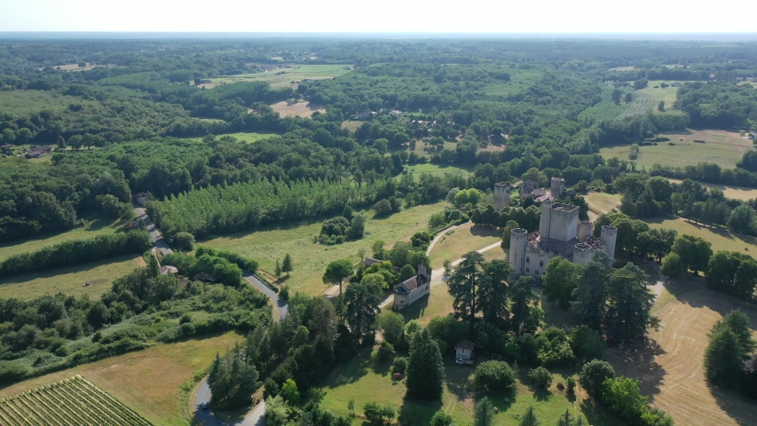 Aerial view of ancient fortified castle of Chateau de Roquetaillade in sunny summer day, Mazeres, France