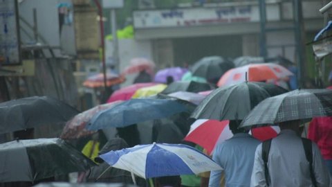 MUMBAI, SEPTEMBER 2019: crowd people walking with umbrella during rainy season at Mumbai, India